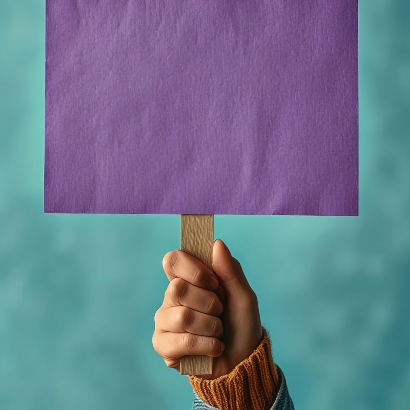 holding blank signage